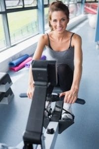 Women exercising on a rowing machine