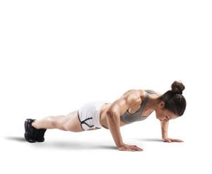 Fit woman doing a Push-Up