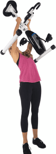 Woman lifting a light exercise bike