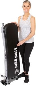 Woman with folded gym equipment.