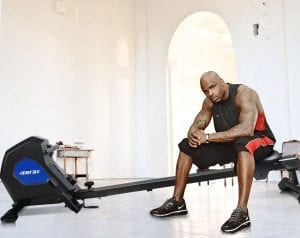 Man sitting on a Merax Magnetic Exercise Rower