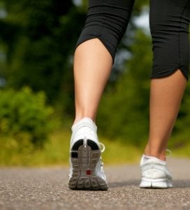 Get fit on a budget - back view of a woman's calves walking for exercise