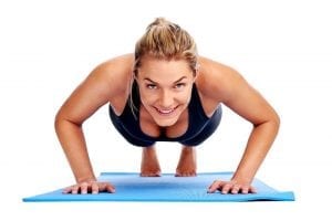 Smiling blonde women doing a Push-Up