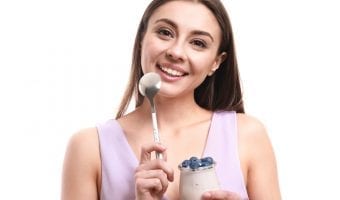 Fast weight loss tips - woman eating yogurt and berries